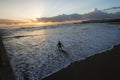 Surfer Enters Ocean Sunrise Royalty Free Stock Photo