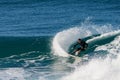 Surfer executing a slashing frontside top-turn. Royalty Free Stock Photo