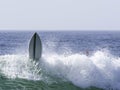 Surfers board taking off  from wave Royalty Free Stock Photo