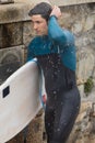 Surfer Finishing Up with a Post-Surf Shower