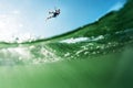 Surfer flying over the water Royalty Free Stock Photo