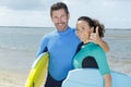 surfer friends on beach with surfing boards Royalty Free Stock Photo