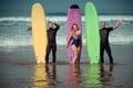 Surfer friends on a beach with a surfing boards Royalty Free Stock Photo