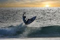 Surfer getting air at sunset