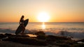 Surfing lifestyle. Surfer girl holding surfboard on the beach. Silhouette of surfer girl during sunset. Golden sunset time. Bali, Royalty Free Stock Photo