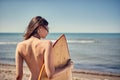 Surfer girl. woman at the beach Royalty Free Stock Photo