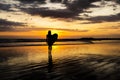 Surfer girl silhouette. Surf woman walking with surfboard