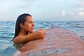 Surfer girl on surfboard have a fun before surfing Royalty Free Stock Photo