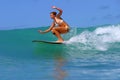 Surfer Girl Surfing a Wave in Hawaii