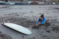 Surfer Girl. Surfing Woman Stretching On Ocean Beach.