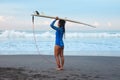 Surfer Girl. Surfing Woman With Surfboard On Head Standing On Sandy Beach. Brunette In Blue Wetsuit Going To Surf In Sea. Royalty Free Stock Photo