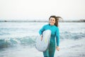 Surfer girl walking with board on the sandy beach. Surfer female.Beautiful young woman at the beach. water sports. Healthy Active Royalty Free Stock Photo