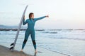 Surfer girl walking with board on the sandy beach. Surfer female.Beautiful young woman at the beach. water sports. Healthy Active Royalty Free Stock Photo