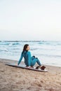 Surfer girl walking with board on the sandy beach. Surfer female.Beautiful young woman at the beach. water sports. Healthy Active Royalty Free Stock Photo