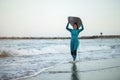 Surfer girl walking with board on the sandy beach. Surfer female.Beautiful young woman at the beach. water sports. Healthy Active Royalty Free Stock Photo