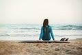 Surfer girl walking with board on the sandy beach. Surfer female.Beautiful young woman at the beach. water sports. Healthy Active Royalty Free Stock Photo