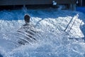 A Surfer Giving It A Shot In A Wave Pool With Big Splashes From The Turns