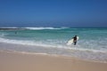 Surfer with golden sand on Corralejo beach Canary islands Spain