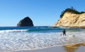 Surfer and Haystack Rock - Pacific City, Oregon