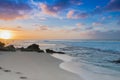 Surfer heading out at sunset on Sunset Beach, Hawaii Royalty Free Stock Photo