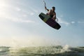 Surfer jumping in front of the camera Royalty Free Stock Photo