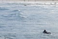 Surfer laying on the beach with peaceful sunny day Royalty Free Stock Photo