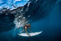 Surfer make duck dive underwater. Surfgirl dive under wave Royalty Free Stock Photo