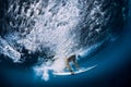 Surfer make duck dive underwater. Surfgirl dive under wave Royalty Free Stock Photo