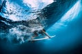 Surfer make duck dive underwater. Surfgirl dive under wave Royalty Free Stock Photo