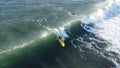 Surfer making a bottom turn.