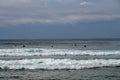 Surfer in the ocean waiting for a wave. Surfers waiting for good surfing waves. Surfers waiting for their wave. Young man waiting Royalty Free Stock Photo