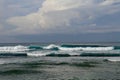 Surfer in the ocean waiting for a wave. Surfers waiting for good surfing waves. Surfers waiting for their wave. Young man waiting Royalty Free Stock Photo