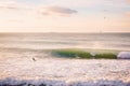 Surfer and perfect big barrel wave. Seascape with sunrise colors Royalty Free Stock Photo