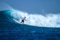 Surfer on perfect blue aquamarine wave, empty line up, perfect for surfing, clean water, Indian Ocean Royalty Free Stock Photo