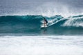 Surfer on perfect blue aquamarine wave, empty line up, perfect for surfing, clean water, Indian Ocean Royalty Free Stock Photo