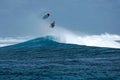 Surfer on perfect blue aquamarine wave, empty line up, perfect for surfing, clean water, Indian Ocean Royalty Free Stock Photo