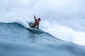 Surfer on perfect blue aquamarine wave, empty line up, perfect for surfing, clean water, Indian Ocean Royalty Free Stock Photo