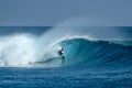 Surfer on perfect blue big tube wave, empty line up, perfect for surfing, clean water in Indian Ocean