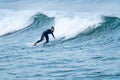 Surfer performing a bottom turn Royalty Free Stock Photo