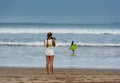 Surfer photographer , Kuta Beach, Bali, Indonesia Royalty Free Stock Photo