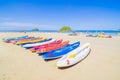 Surfer on Pretty beach and ocean with sailboat Royalty Free Stock Photo