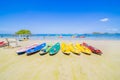 Surfer on Pretty beach and ocean with sailboat Royalty Free Stock Photo