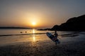 Surfer On Pwllgwaelod Beach And Dinas Head At The Wild Atlantic Coast Of Pembrokeshire In Wales, United Kingdom