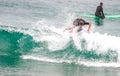 Surfer ride waves in slow motion at Las Canteras beach in Las Palmas de Gran Canaria, Spain