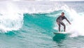 Surfer ride waves in slow motion at Las Canteras beach in Las Palmas de Gran Canaria, Spain