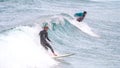 Surfer ride waves in slow motion at Las Canteras beach in Las Palmas de Gran Canaria, Spain