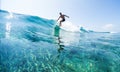 Surfer rides ocean wave Royalty Free Stock Photo