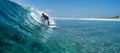 Surfer rides ocean wave