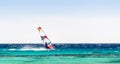 Surfer rides in the Red Sea on the background of a clear sky in Egypt. Dahab Royalty Free Stock Photo