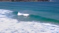 A surfer rides a wave at bondi beach, australia`s famous beach Royalty Free Stock Photo